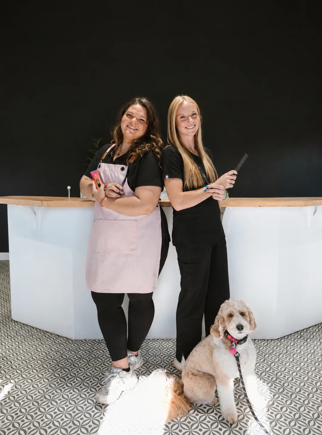 Nick and Rebecca Willis with a happy groomed dog at The Double U Grooming Co.